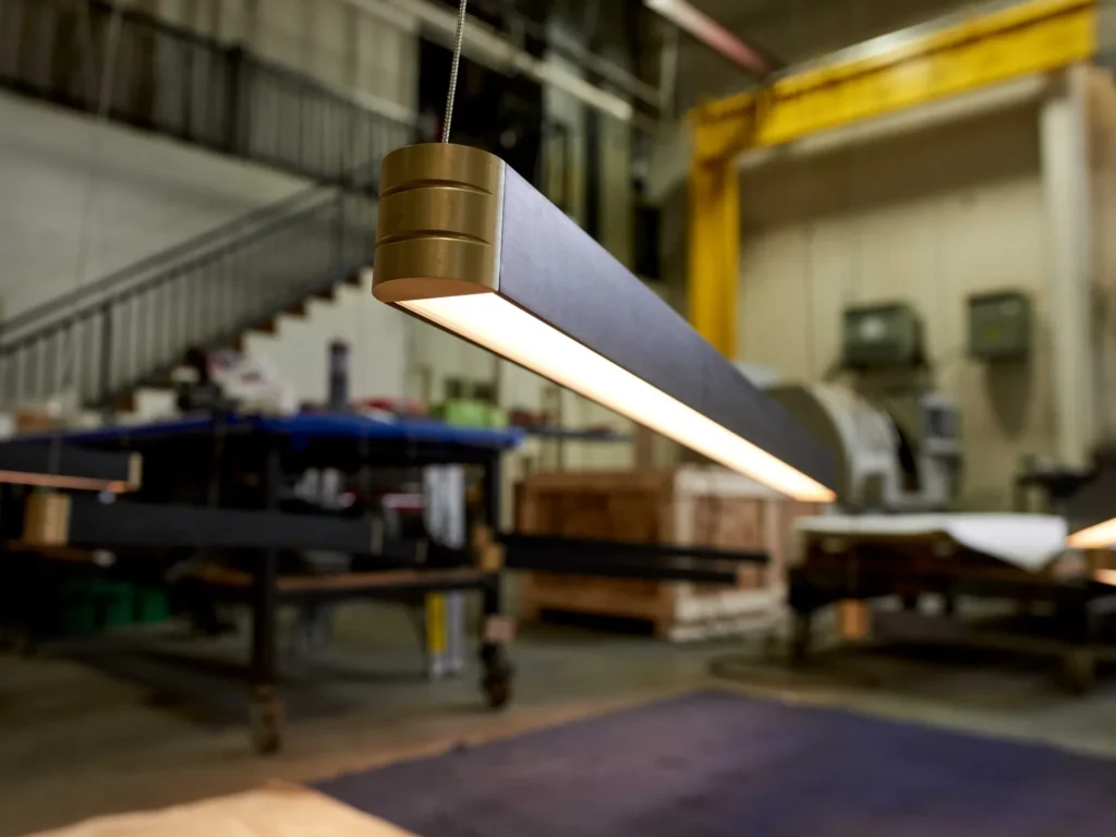 Retta linear LED light with aluminum body, frosted acrylic diffuser, and precision-machined end caps. Designed and manufactured by Karice.