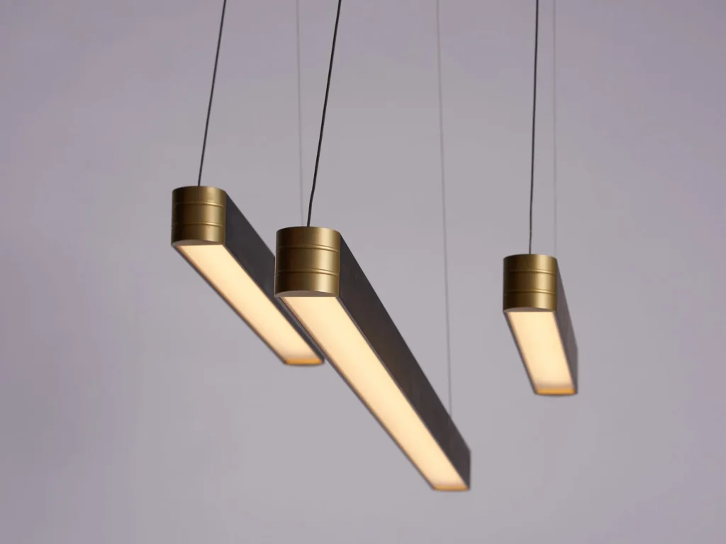 Retta linear LED light with aluminum body, frosted acrylic diffuser, and precision-machined end caps. Designed and manufactured by Karice.