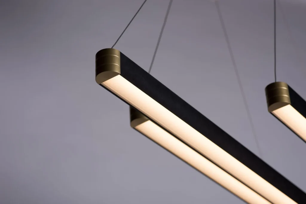 Retta linear LED light with aluminum body, frosted acrylic diffuser, and precision-machined end caps. Designed and manufactured by Karice.
