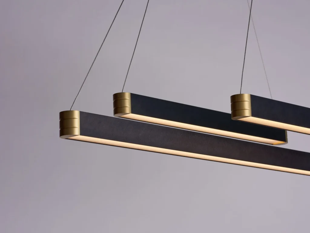 Retta linear LED light with aluminum body, frosted acrylic diffuser, and precision-machined end caps. Designed and manufactured by Karice.