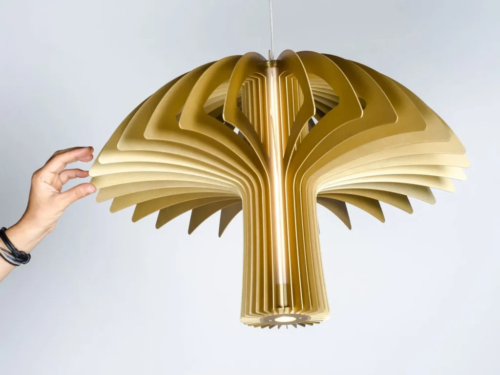 Shroom LED pendant light with mushroom-inspired form, aluminum blade construction, and illuminated acrylic core. Designed and manufactured by Karice.