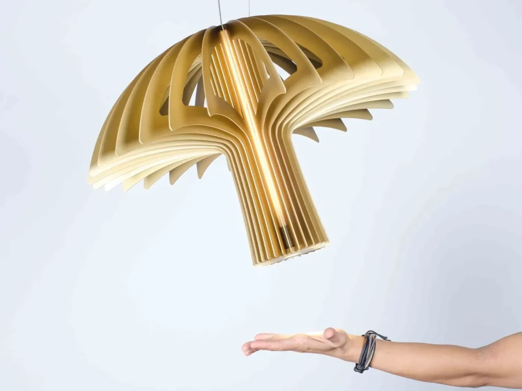 Shroom LED pendant light with mushroom-inspired form, aluminum blade construction, and illuminated acrylic core. Designed and manufactured by Karice.