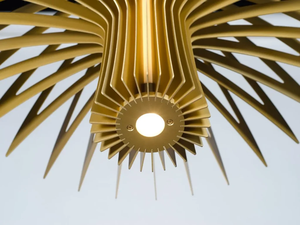 Shroom LED pendant light with mushroom-inspired form, aluminum blade construction, and illuminated acrylic core. Designed and manufactured by Karice.