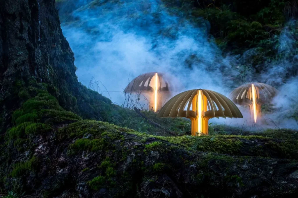 Shroom LED pendant light with mushroom-inspired form, aluminum blade construction, and illuminated acrylic core. Designed and manufactured by Karice.