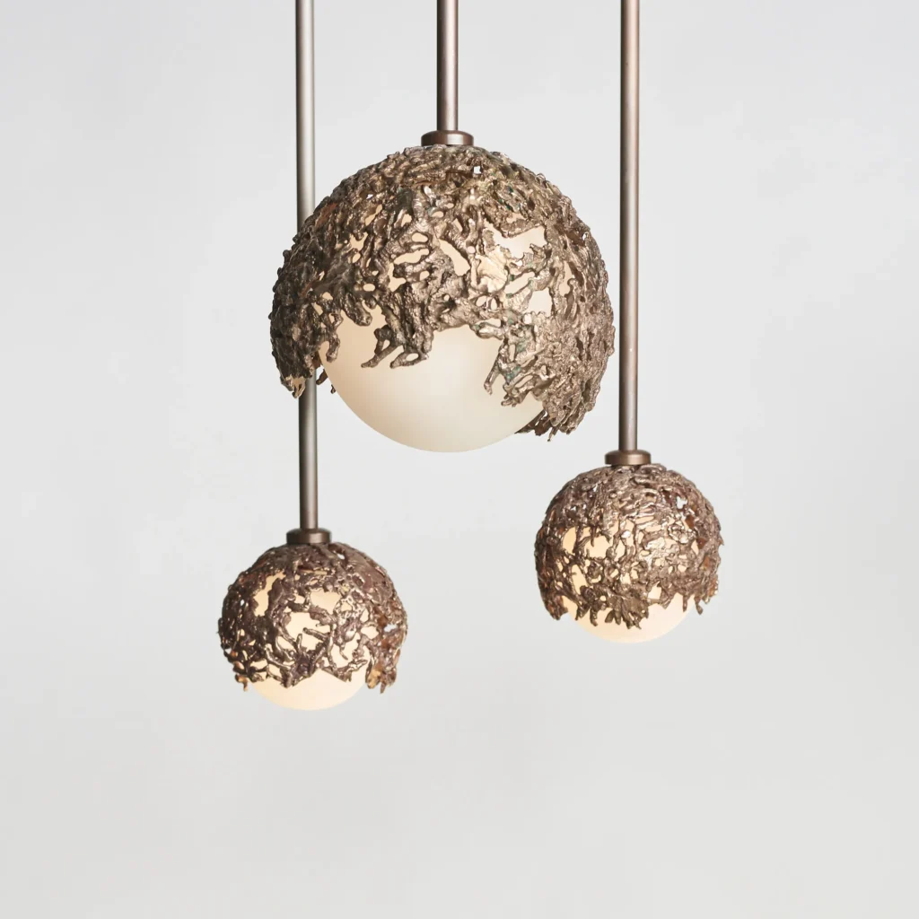 Spheres bronze sculptural light with hand-blown glass globes and dim-to-warm LED technology. Designed and manufactured by Karice, in collaboration with Marie Khouri.
