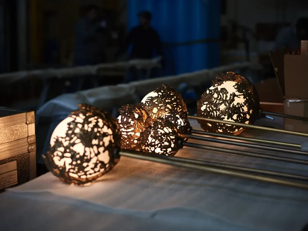 Spheres bronze sculptural light with hand-blown glass globes and dim-to-warm LED technology. Designed and manufactured by Karice, in collaboration with Marie Khouri.