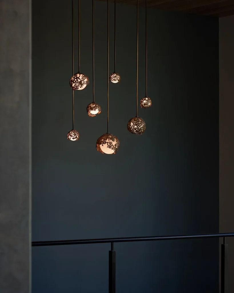 Spheres bronze sculptural light with hand-blown glass globes and dim-to-warm LED technology. Designed and manufactured by Karice, in collaboration with Marie Khouri.
