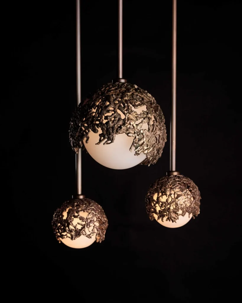 Spheres bronze sculptural light with hand-blown glass globes and dim-to-warm LED technology. Designed and manufactured by Karice, in collaboration with Marie Khouri.