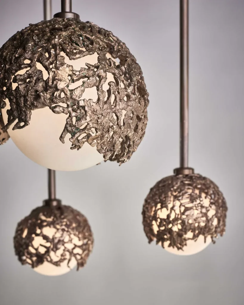 Spheres bronze sculptural light with hand-blown glass globes and dim-to-warm LED technology. Designed and manufactured by Karice, in collaboration with Marie Khouri.