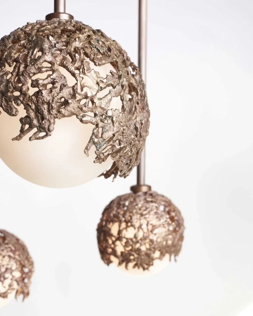 Spheres bronze sculptural light with hand-blown glass globes and dim-to-warm LED technology. Designed and manufactured by Karice, in collaboration with Marie Khouri.