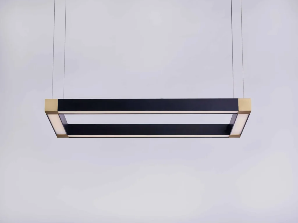 TETRA rectangular LED light with four cube-shaped corner details and tunable color temperature illumination. Designed and manufactured by Karice.