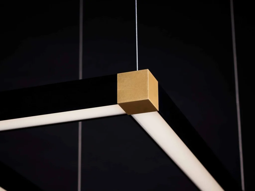 TETRA rectangular LED light with four cube-shaped corner details and tunable color temperature illumination. Designed and manufactured by Karice.