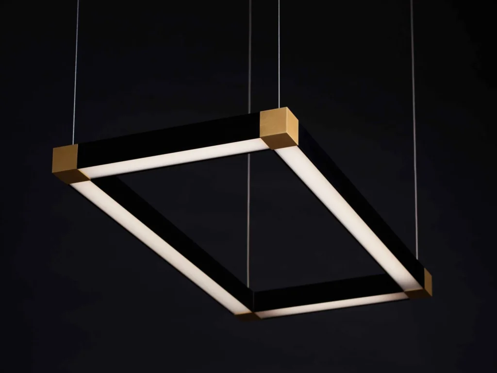 TETRA rectangular LED light with four cube-shaped corner details and tunable color temperature illumination. Designed and manufactured by Karice.