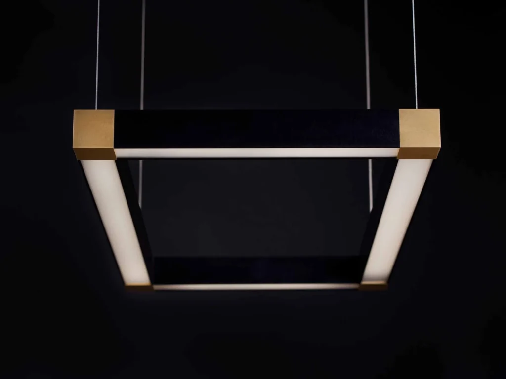 TETRA rectangular LED light with four cube-shaped corner details and tunable color temperature illumination. Designed and manufactured by Karice.